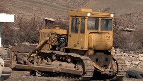 Weathered, rusty farm tractors parked in rural settings, showcasing their age and past utility. Ideal for agricultural history, vintage machinery, and countryside themes. - Powered by Shutterstock - Get 15% off with code: PIKWIZARD15