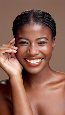 Happy black woman, face and skincare for glow, beauty and facial hydration. Cosmetics, skin texture and African model with dermatology, wellness and natural with self care on brown studio background