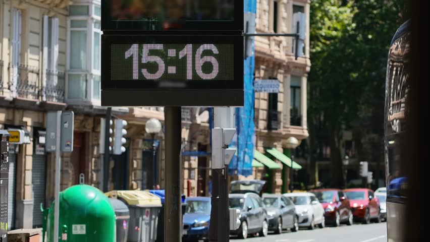 Street thermometer in Bilbao city displays terrifying 50 degrees Celsius during intense summer heatwave in Spain, highlighting extreme temperature and climate conditions in urban environment.