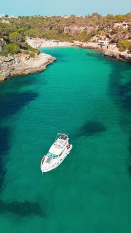 Aerial top down view of the Cala Llombards beach in Mallorca, Balearic Islands, Spain. Stunning Mediterranean Sea coast with turquoise water sea bay and white sand beach. Mallorca travel destinations