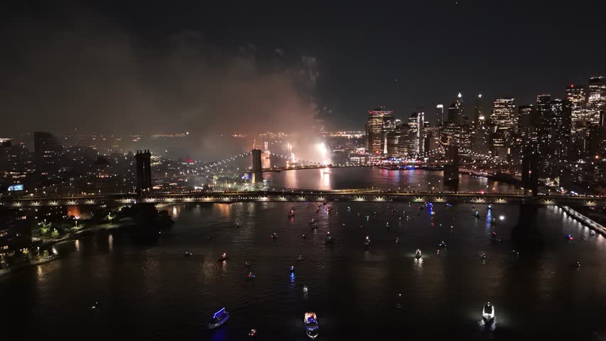 Fireworks illuminate night sky over East River in New York for 4th of July event