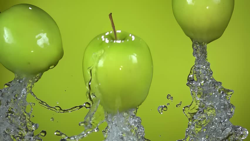 Juicy green apples launch upwards in a dynamic burst of fresh water. A vibrant, energetic shot on a green background, symbolizing health, freshness, and natural vitamins - Powered by Shutterstock - Get 15% off with code: PIKWIZARD15