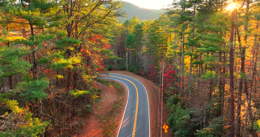 Blue Ridge Parkway in autumn. Mountain pass road between dense woods in seasonal colors in North Carolina