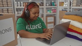 Focused volunteer woman typing with hands on laptop in building; compassion service community outreach. - Powered by Shutterstock - Get 15% off with code: PIKWIZARD15