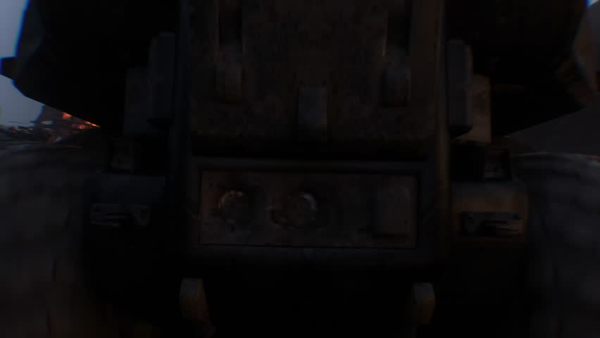 apocalyptic war machine drives through a destroyed burning city.