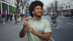 Man dancing joyfully on a bustling urban street, surrounded by blurred city life and winter-dressed pedestrians, embodying vibrant city vibes and carefree moments. - Powered by Shutterstock - Get 15% off with code: PIKWIZARD15