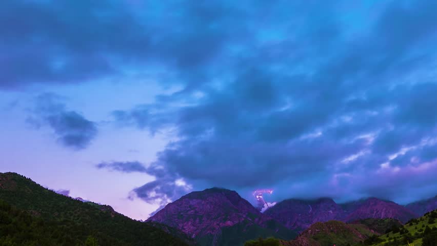 Dramatic Mountain Landscape Under a Blue and Purple Sky: A Twilight Masterpiece