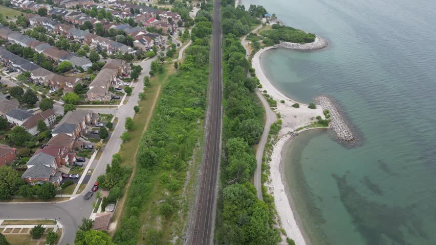 Drone footage of rail tracks cutting through Rouge marshland