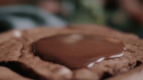 Slow Motion: Rich Melted Chocolate Pouring Onto Delicious Brownie or Chocolate Cake. Decadent Dessert Topping. - Powered by Shutterstock - Get 15% off with code: PIKWIZARD15