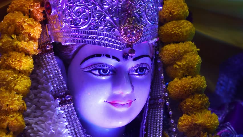Smiling Idol of Sita Ram with Floral Decor