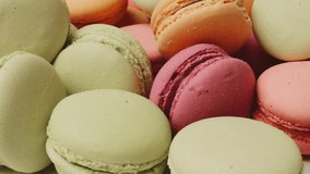 Close-up Pan: Assorted Colorful French Macarons. Delicious Pastel Confectionery Pile for Sweet Backgrounds and Desserts. - Powered by Shutterstock - Get 15% off with code: PIKWIZARD15