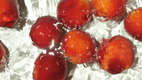 Top View of Ripe Peaches Floating in Water with Ripples Slow Motion - Powered by Shutterstock - Get 15% off with code: PIKWIZARD15