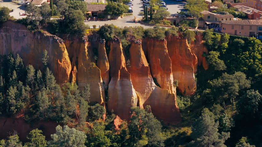 Aerial of ochre cliffs and exposed red soil in the quarry area of Roussillon