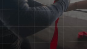 Trainer picking up red wrap and hand wrapping athlete for boxing prep with transparent data charts. Boxing, training, support, performance, fitness, coaching, biomechanics - Powered by Shutterstock - Get 15% off with code: PIKWIZARD15