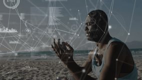 Beach yogi lifting hands into Gyan mudra and activating digital network overlay for wellness. Meditation, mindfulness, serenity, technology, connectivity, relaxation, digital - Powered by Shutterstock - Get 15% off with code: PIKWIZARD15