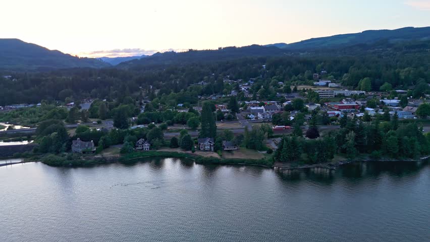 Aerial orbit of Stevenson, Washington at dusk, with views of Columbia River, Bobs Beach, and American Pride paddle wheel river cruise ship