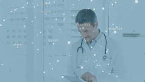 Doctor tapping tablet screen analyzing patient data beneath translucent network overlay and smiling. Medical technology, healthcare innovation, digital health, telemedicine, futuristic, clinical, data - Powered by Shutterstock - Get 15% off with code: PIKWIZARD15