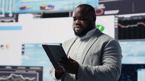 African american businessman contemplating about new powerful ideas to obtain funds, data insights for the financial and KPI projections decision making. Forecasting for productivity. Camera B. - Powered by Shutterstock - Get 15% off with code: PIKWIZARD15