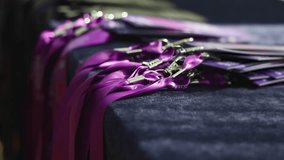 Process of checking in on conference congress forum event, registration desk table, visitors and attendees receiving purple violet lanyard with name badge and entry, and register electronic ticket - Powered by Shutterstock - Get 15% off with code: PIKWIZARD15