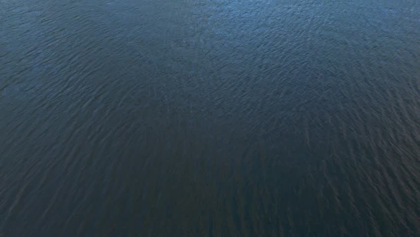 Cinematic aerial reveal of the Columbia River Gorge at dusk, captured from Stevenson, Washington, with scenic mountain views across the river in Oregon