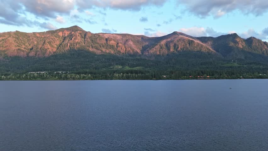 Aerial truck shot of the Columbia River Gorge at dusk, captured from Stevenson, Washington, with scenic mountain views across the river in Oregon