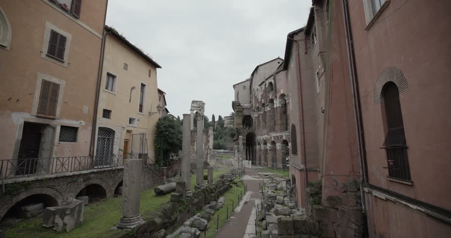Ghetto Ruins in Rome, Italy in the Jewish Ghetto on Via del Foro Piscario with view of Marcello Theatre and Temples of Apollo Sosiano and Bellona. Floating Handheld SloMo Shot