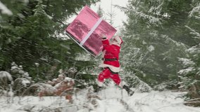 Funny Santa Claus rushes with huge gift box through winter forest with Christmas trees to congratulate people on New Year. - Powered by Shutterstock - Get 15% off with code: PIKWIZARD15