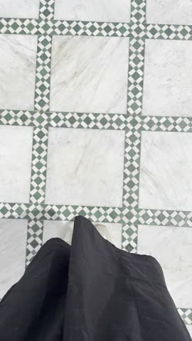 Woman walks over beautiful tiled floor in Morocco. Marrakech floors, stunning tile design and amazing colours, exploring the city