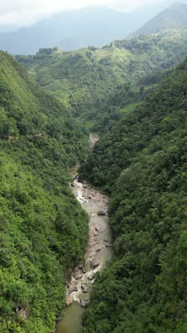 Aerial view of river through hills, Vietnam.