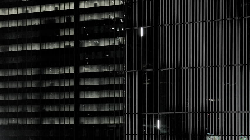 Grids of Skyscrapers Overlap at Monochrome Night, with Transparent Elevator Descending to Lower Floors  |  Shibuya Station Area, Tokyo, Japan
