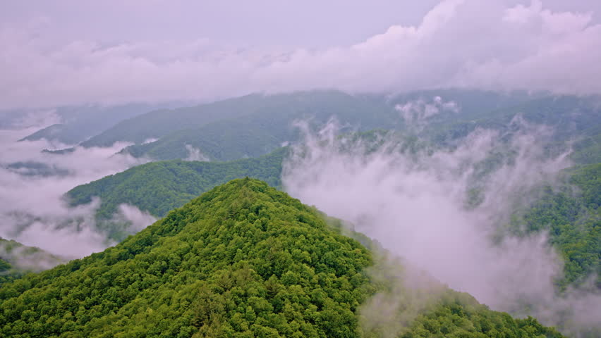 The Great Smoky Mountains seen from above, fading into mist.