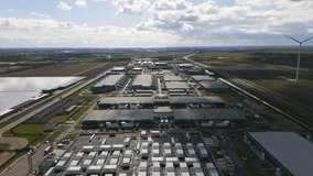 Drone footage showing the scale and symmetry of a massive data center and energy facility in Middenmeer, the Netherlands. - Powered by Shutterstock - Get 15% off with code: PIKWIZARD15