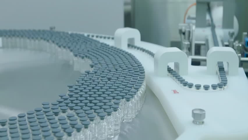 Production of Medical vaccine injection manufacturing line glass vial bottle dietary supplements vial filling line, Bottles of Medicine on a Conveyor Belt Product Line at pharma factory