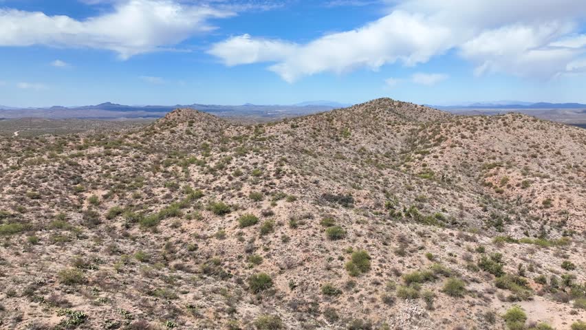 Aerial view of desert hills and sparse vegetation, United States.