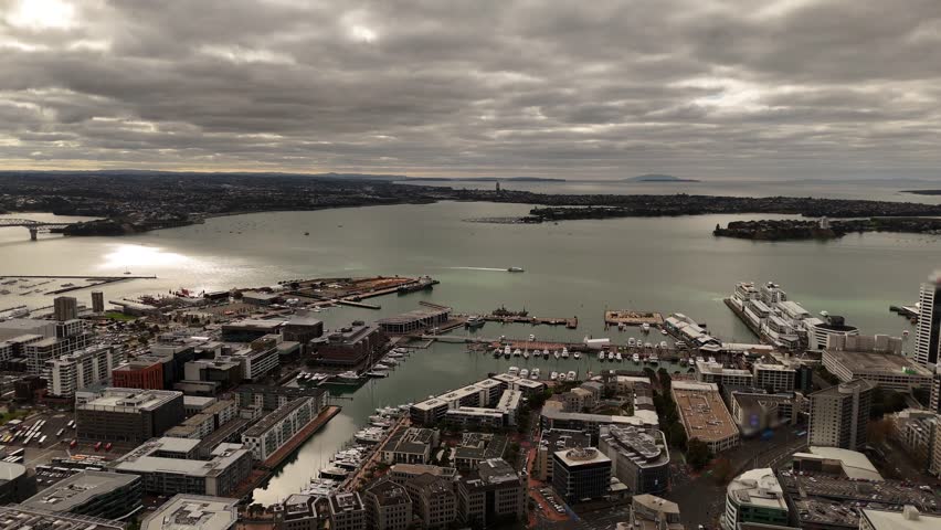 Auckland CBD, Viaduct Harbour, city port, Waitemata Harbour with boats and ferries, New Zealand. Aerial drone panoramic view