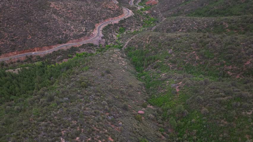 Aerial view of winding road through hills, United States.