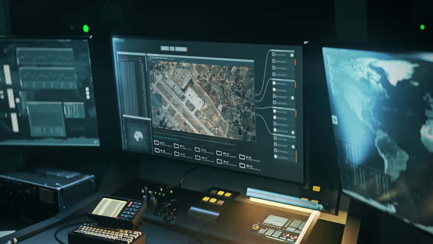 Operating robotic innovation tech from the military control room. Robotic innovation tech examining the city areas. Robotic innovation tech locates the coordinates of the enemy forces airbase.