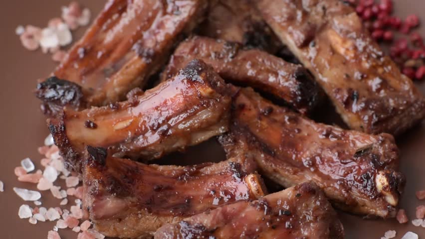 Meat, beef ribs in a marinade grilled with salt and spices. Grilled ribs, barbecued meat food