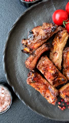 Meat, beef ribs in a marinade grilled with salt and spices. Grilled ribs, barbecued meat food
