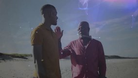 Father placing hand on son's shoulder at beach, initiating technology nodes symbolizing connection. Family, mentorship, guidance, empowerment, connection, digital, technology - Powered by Shutterstock - Get 15% off with code: PIKWIZARD15