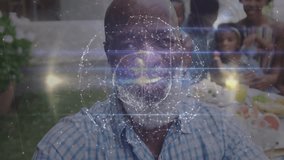 Elderly man holding out camera, initiating globe effect as family posing for selfie technology. Family, generational, outdoor, technology, connectivity, celebration, portrait - Powered by Shutterstock - Get 15% off with code: PIKWIZARD15