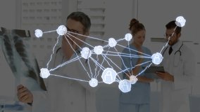 Medical team holding X-ray and tablet while conferring, fading in global network map overlay nodes. Healthcare, collaboration, telemedicine, data visualization, digital health, communication, medical - Powered by Shutterstock - Get 15% off with code: PIKWIZARD15