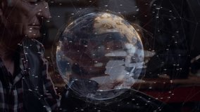 Senior man tapping tablet with stylus and exploring rotating holographic Earth tech network lines. Digital, innovation, futuristic, technology, data visualization, mobility - Powered by Shutterstock - Get 15% off with code: PIKWIZARD15