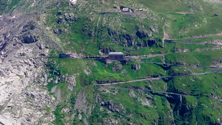 The beautiful winding road, Aerial view of the road to Furkapass in the Swiss Alps, Kanton Wallis , mountain road. The ice-free bed of the Rhone Glacier, Alpine panorama, Landscape of the Swiss Alps
