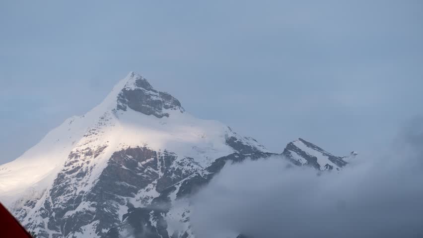 4K Zoom in Time Lapse shot of dark clouds rolling over mountain peak during monsoon season at Lahaul, Himachal Pradesh, India. Rain clouds over Ghepan peak. Nature landscape. Travel concept