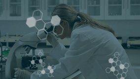 Female scientist placing slide on microscope causing hexagon code overlays and focusing for science. Research, innovation, technology, analytics, precision, laboratory, discovery - Powered by Shutterstock - Get 15% off with code: PIKWIZARD15