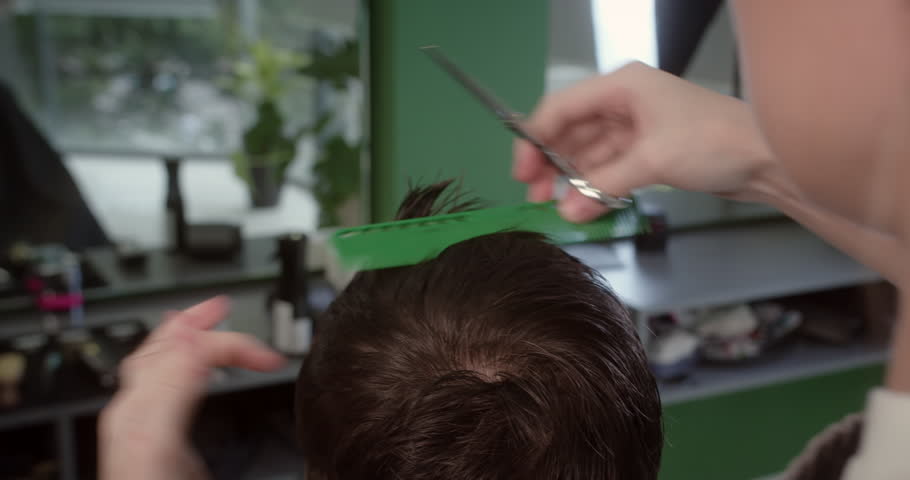 Barber wets client