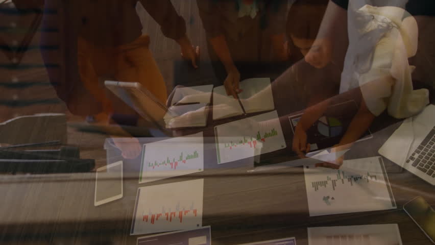 Team leaning around table, tapping tablet and analyzing finance charts, causing line graph overlay. Collaboration, teamwork, data analysis, corporate, professionalism, modern, strategy - Powered by Shutterstock - Get 15% off with code: PIKWIZARD15