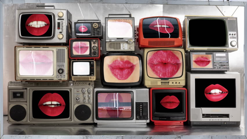 large outdoor advertising board with female red lips on the screen 