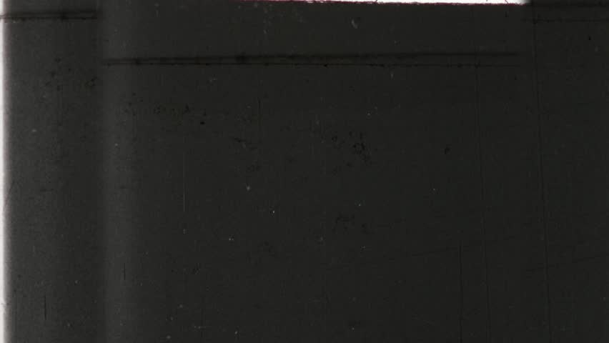 Black and White Universal Countdown Movie Leader. Countdown Clock from 12 to 2. Old film rolling effect. Triangular design from distinct vintage film. 4K scan of archival print 
